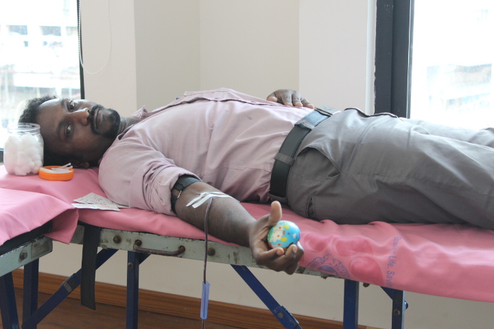 patient lying on the bed at crescent school of business blood donation camp